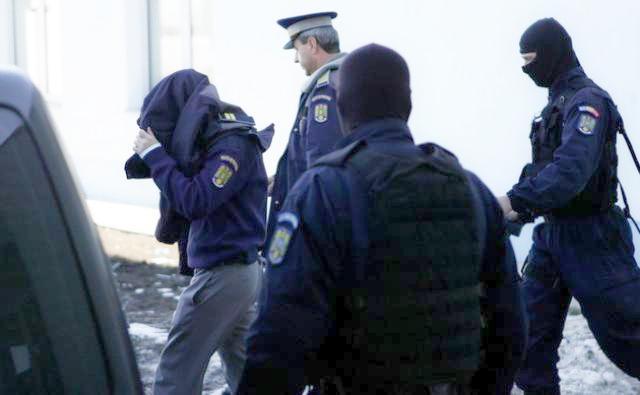 Polițist din Satu Mare, reținut de procurorii DNA