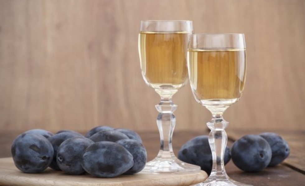 Plum brandy or schnapps with fresh and tasty plum