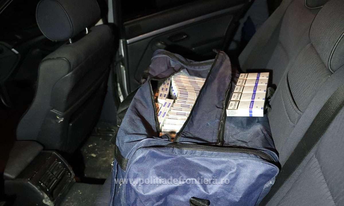 Doi tineri, cercetați pentru contrabandă, au rămas fără BMW și fără țigări